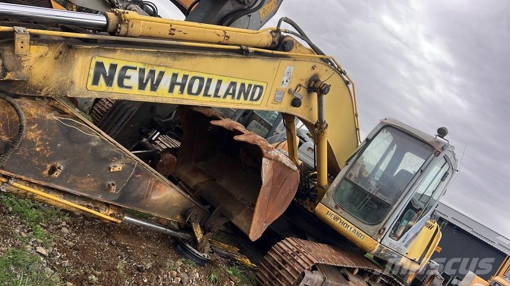 New Holland E 215 B Strēles un kausi
