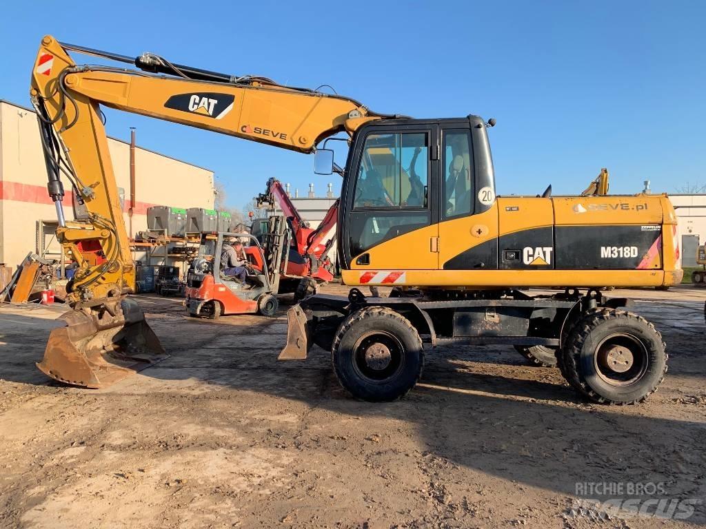 CAT M 318 D Ekskavatori uz riteņiem