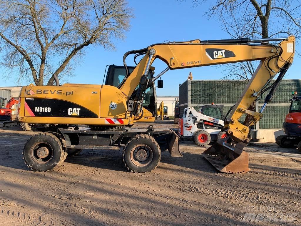 CAT M 318 D Ekskavatori uz riteņiem