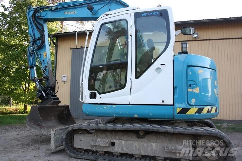  New Hollan E 70 BSR Vidēja lieluma ekskavatori 7 t - 12 t