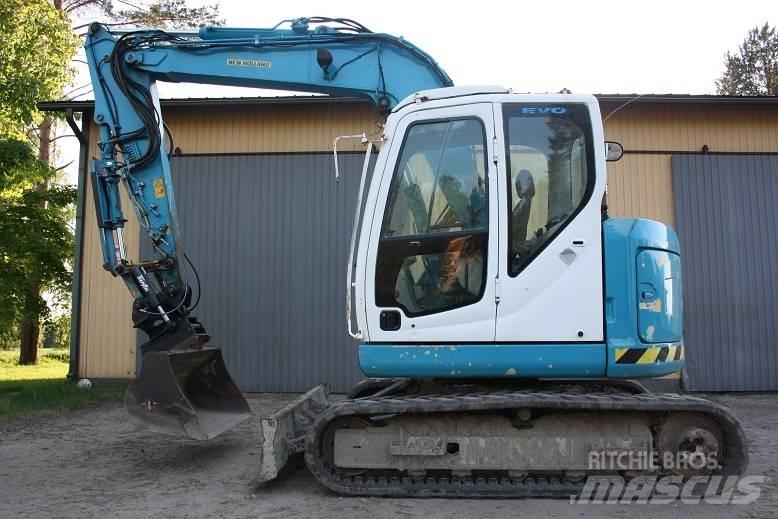  New Hollan E 70 BSR Vidēja lieluma ekskavatori 7 t - 12 t