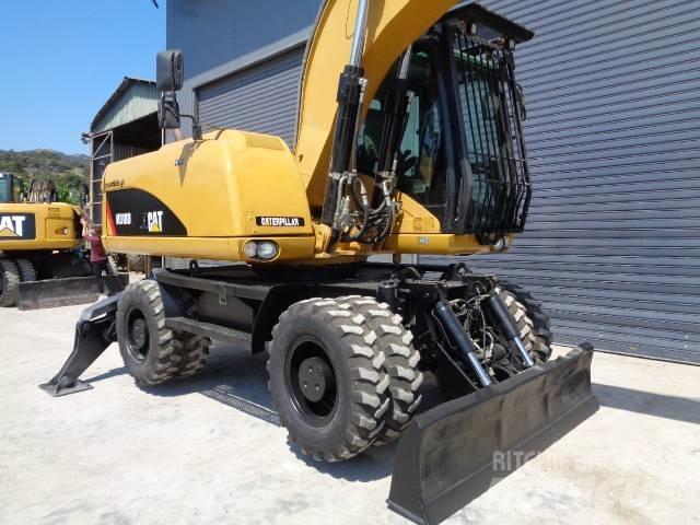 CAT M 318 D Ekskavatori uz riteņiem