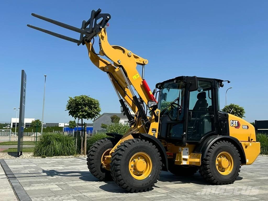 CAT 906 Iekrāvēji uz riteņiem