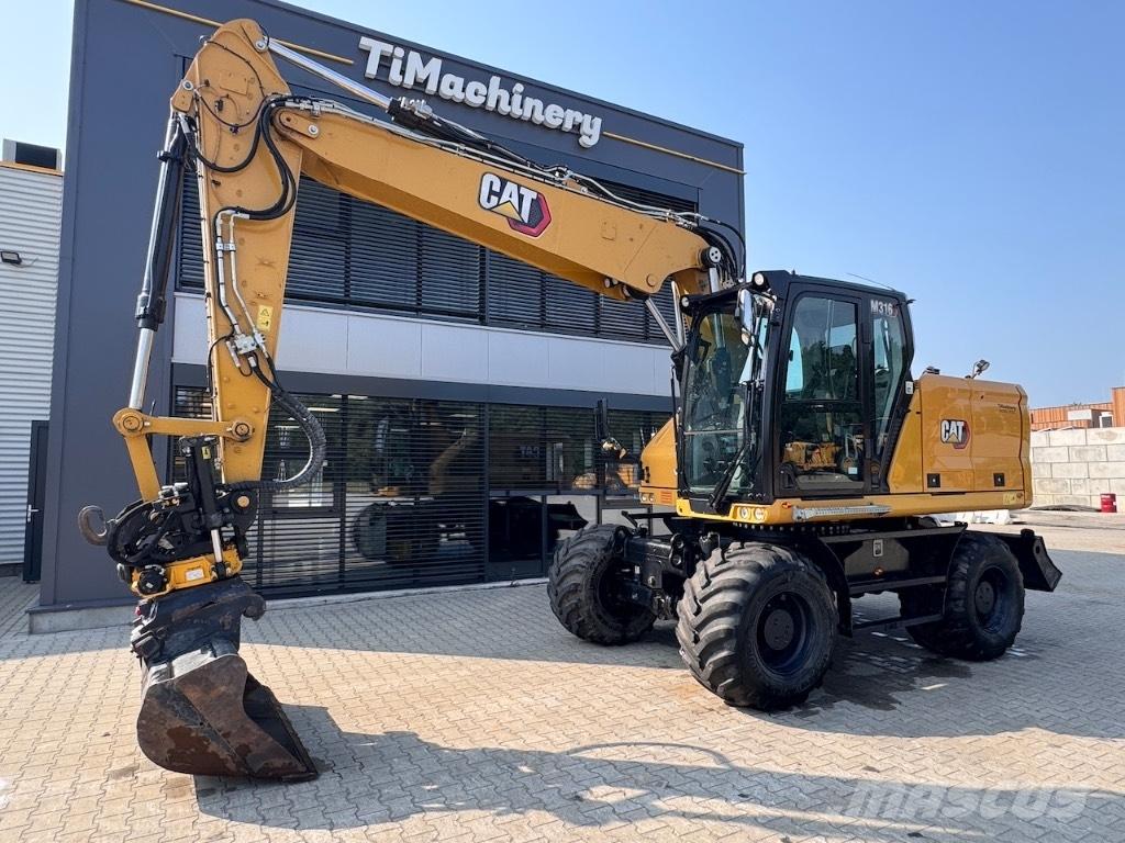 CAT M316 Ekskavatori uz riteņiem