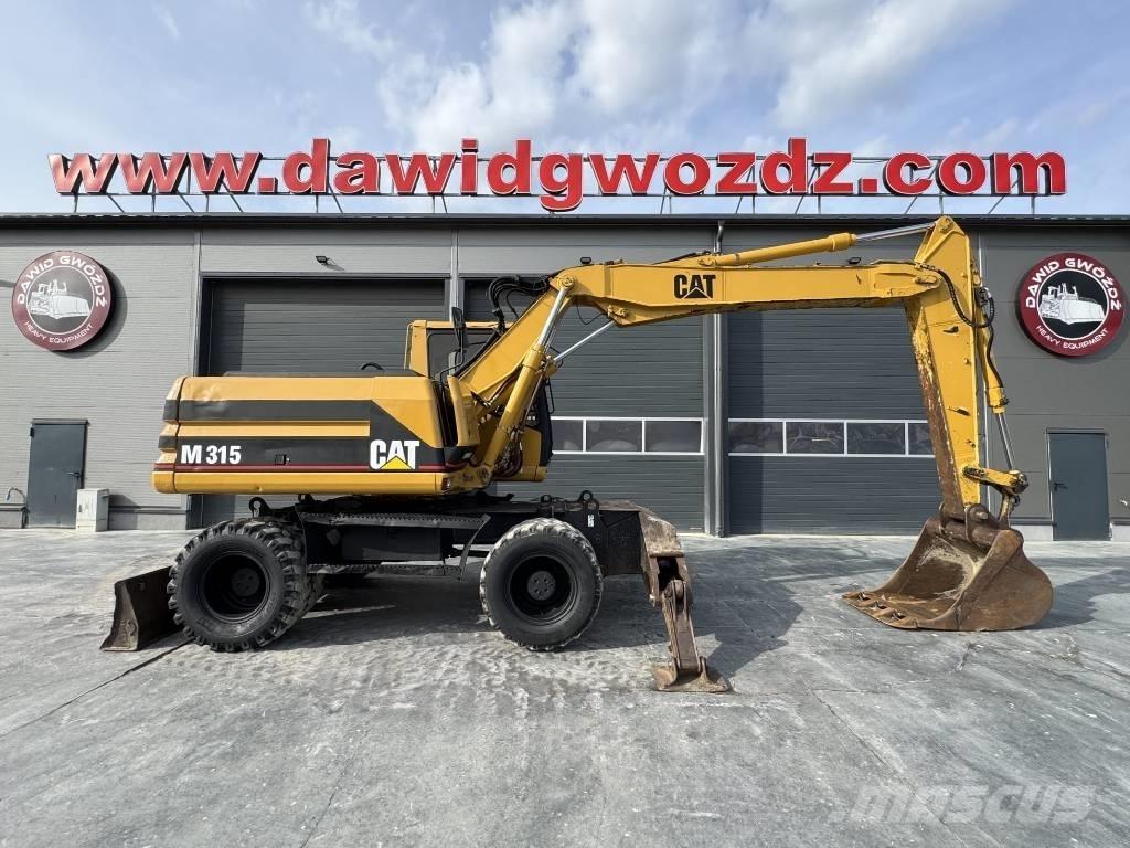 CAT M 315 Ekskavatori uz riteņiem