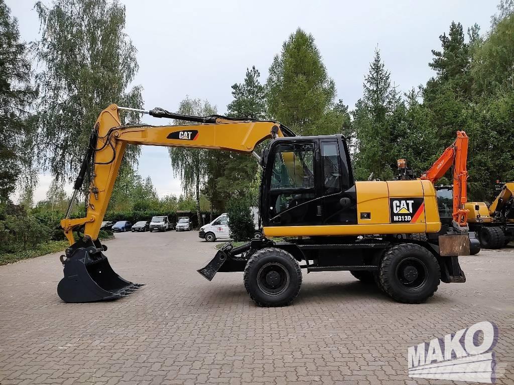 CAT M 313 D Ekskavatori uz riteņiem