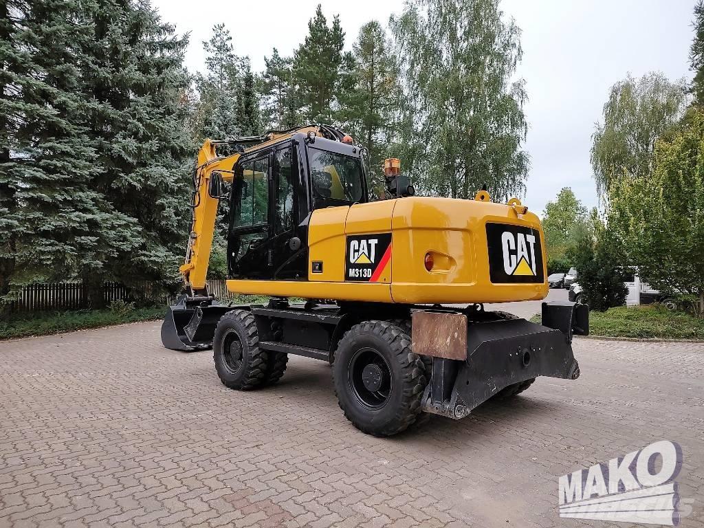 CAT M 313 D Ekskavatori uz riteņiem