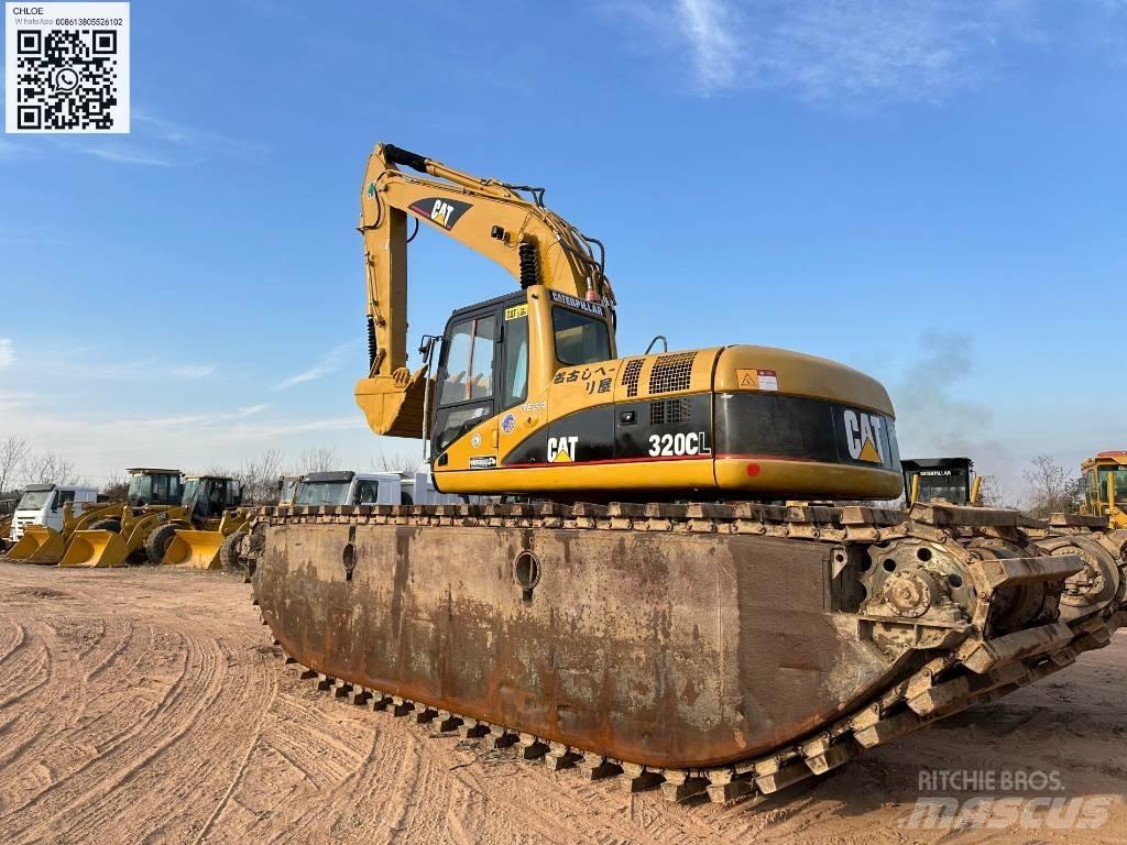 CAT 320 C L Amfībijas tipa ekskavatori