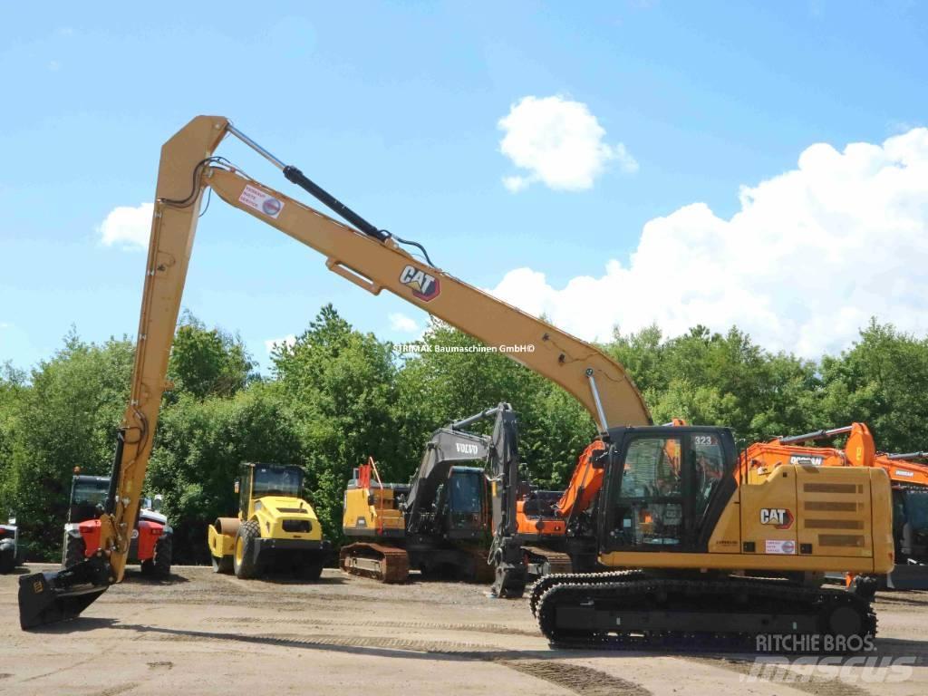 CAT 323 LR Ekskavatori tālās sniedzamības darbiem