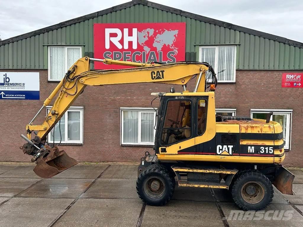 CAT M315 +ROTO CE Ekskavatori uz riteņiem
