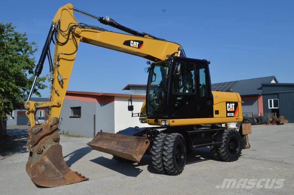 CAT M 313 D Ekskavatori uz riteņiem