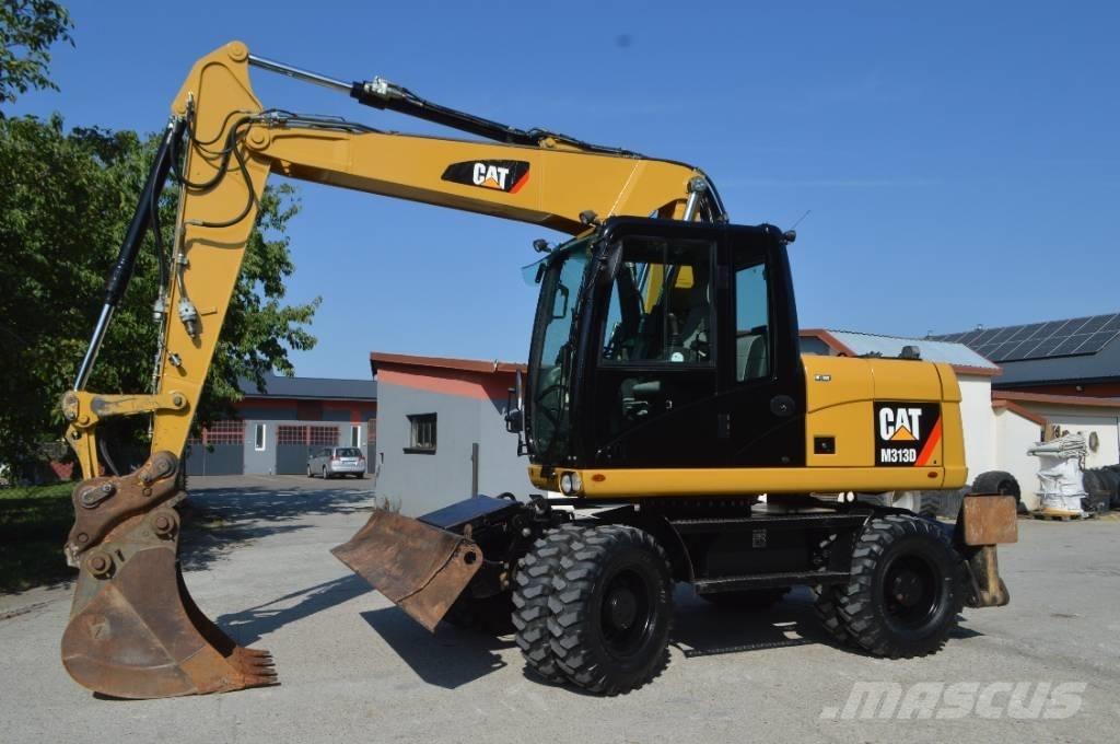 CAT M 313 D Ekskavatori uz riteņiem