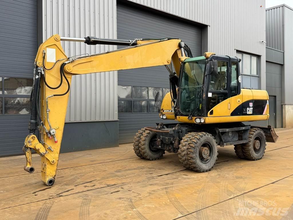 CAT M315D Ekskavatori uz riteņiem