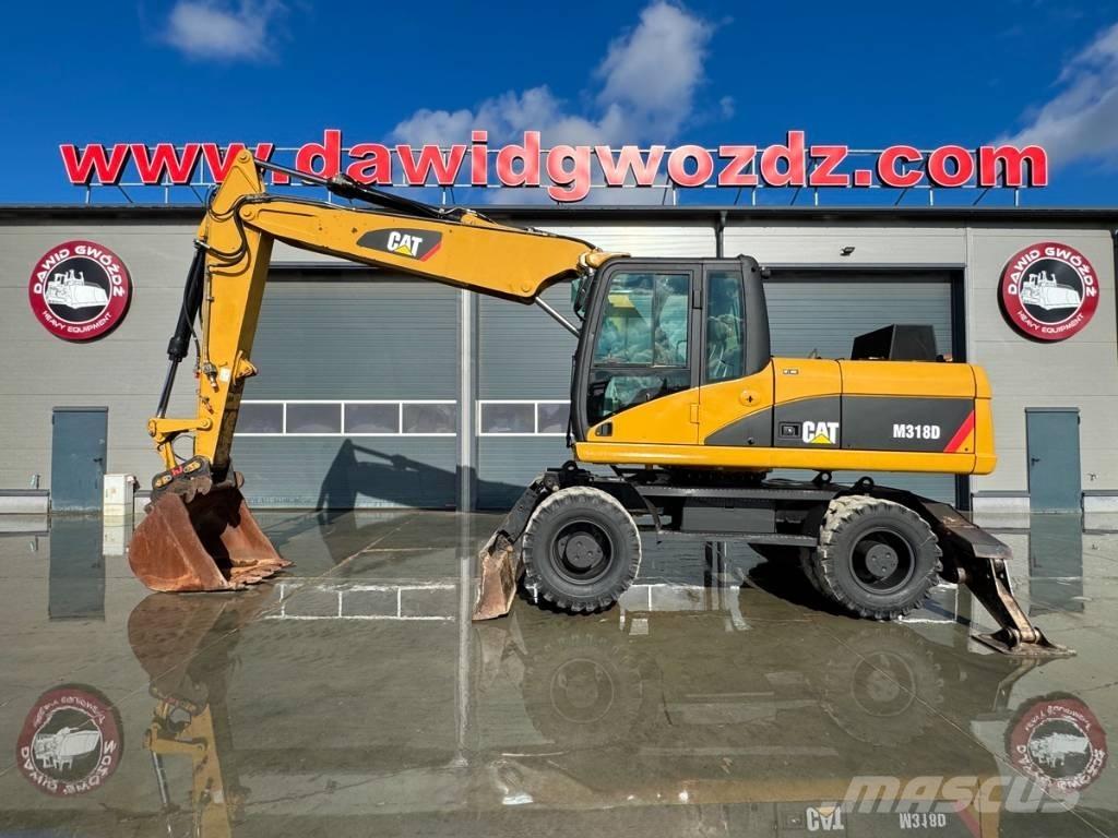CAT M 318 D Ekskavatori uz riteņiem