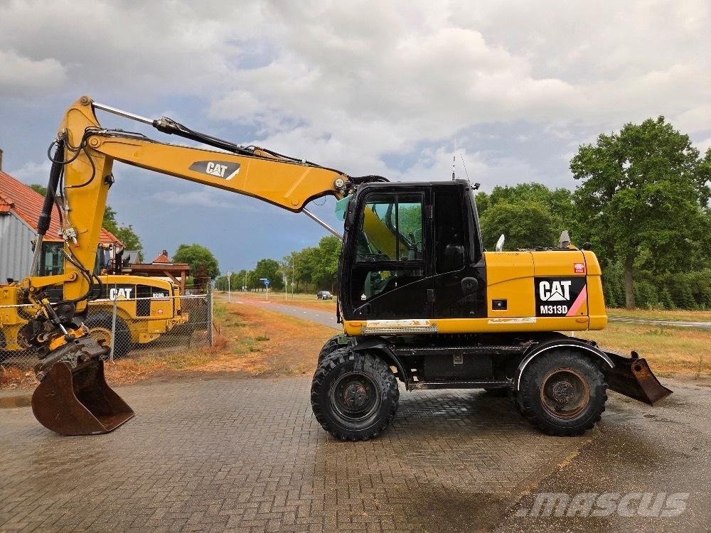 CAT M313D Ekskavatori uz riteņiem