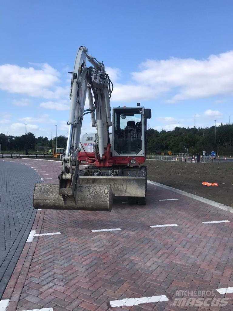 Takeuchi TB295W Ekskavatori uz riteņiem