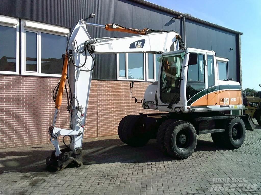 CAT M313D Ekskavatori uz riteņiem