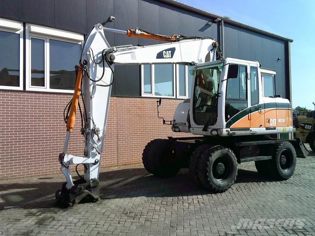 CAT M313D Ekskavatori uz riteņiem