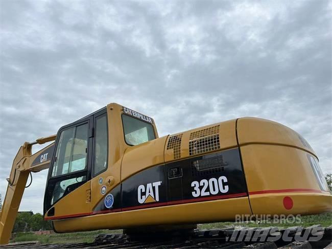 CAT 320 C Amfībijas tipa ekskavatori
