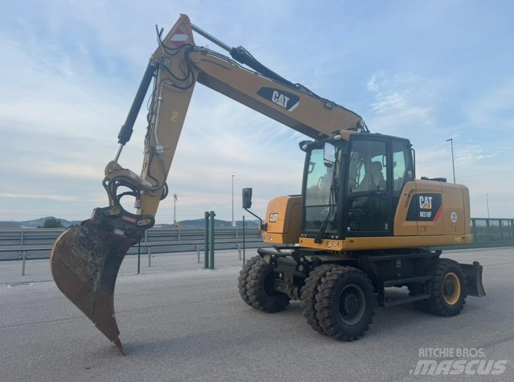 CAT M 318 F Ekskavatori uz riteņiem