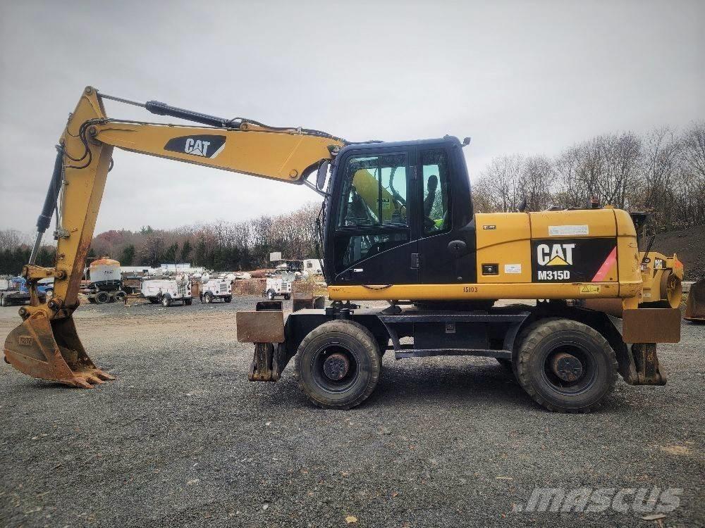 CAT M 315 D Ekskavatori uz riteņiem