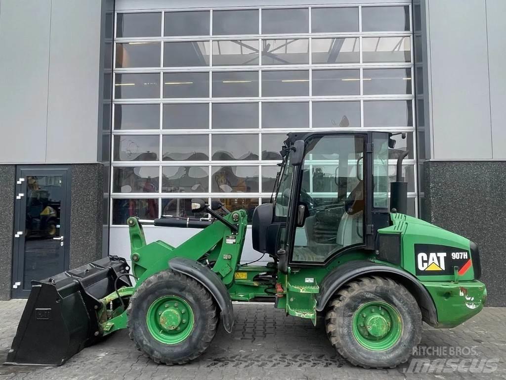 CAT 907H Iekrāvēji uz riteņiem
