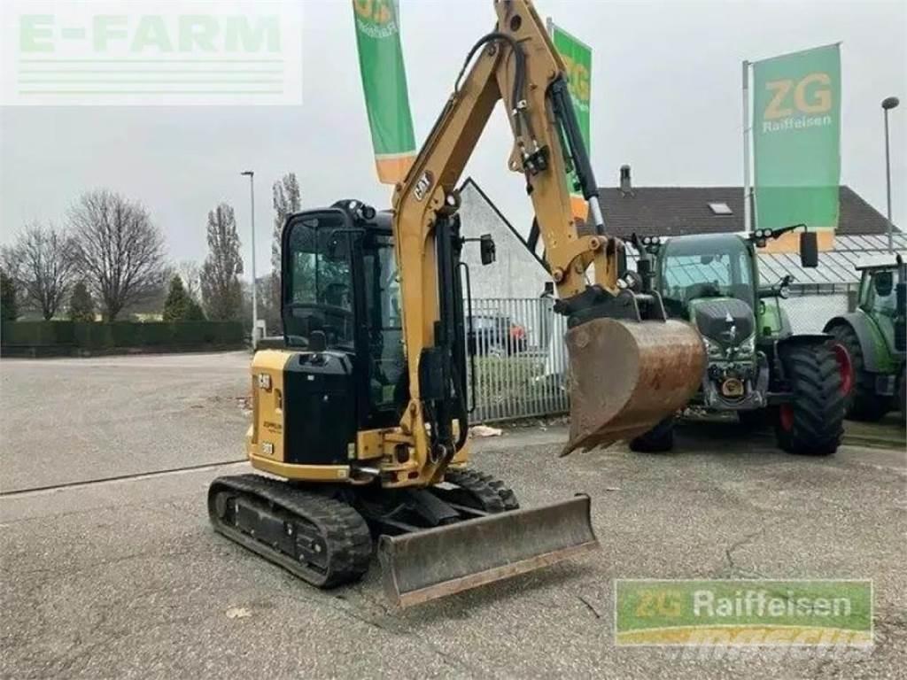 CAT 303 minibagger Ekskavatori uz riteņiem
