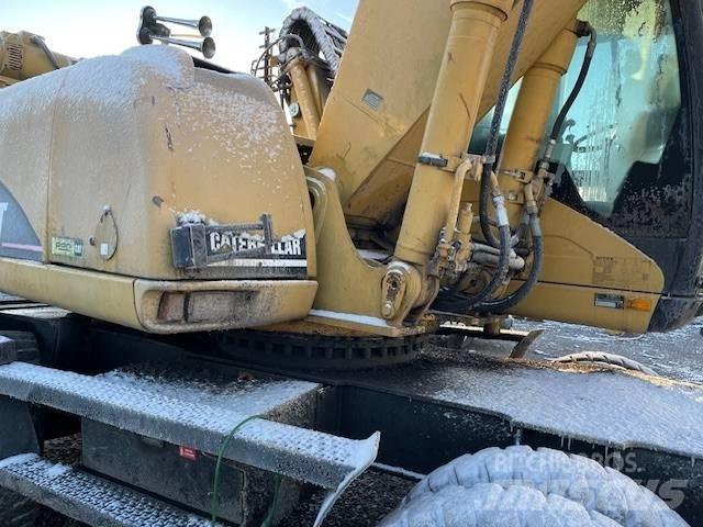 CAT M 322 C MH Ekskavatori uz riteņiem
