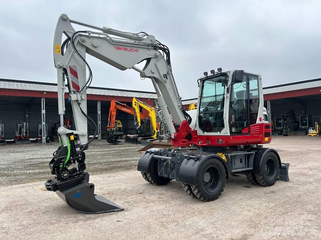 Takeuchi TB395W Ekskavatori uz riteņiem