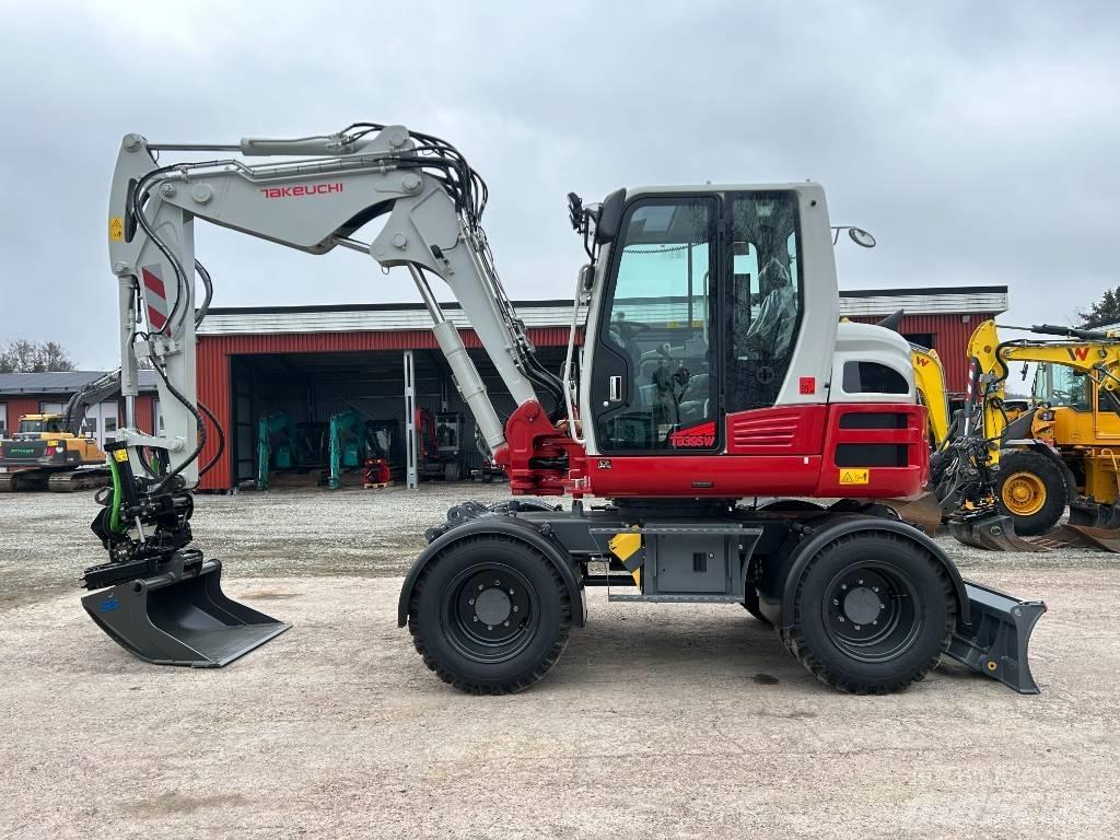 Takeuchi TB395W Ekskavatori uz riteņiem