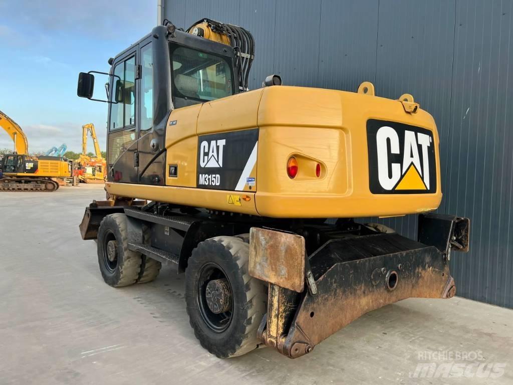 CAT M315D Ekskavatori uz riteņiem