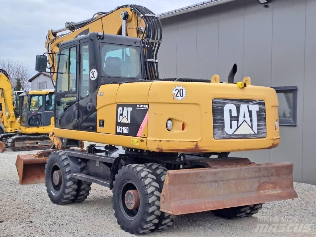 CAT M 316 D Ekskavatori uz riteņiem