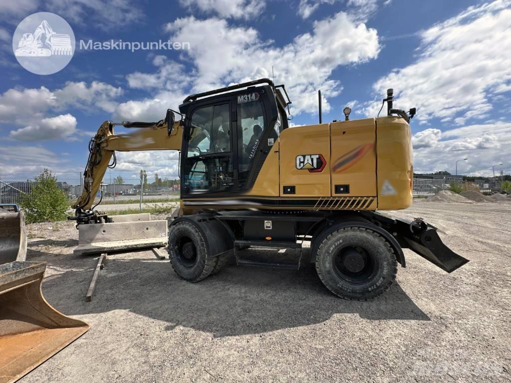 CAT M 314 Ekskavatori uz riteņiem