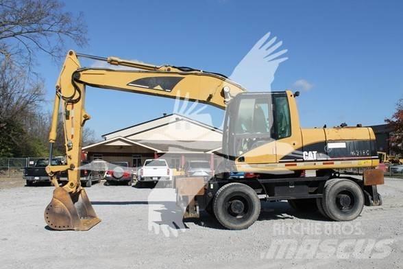CAT M318C Ekskavatori uz riteņiem