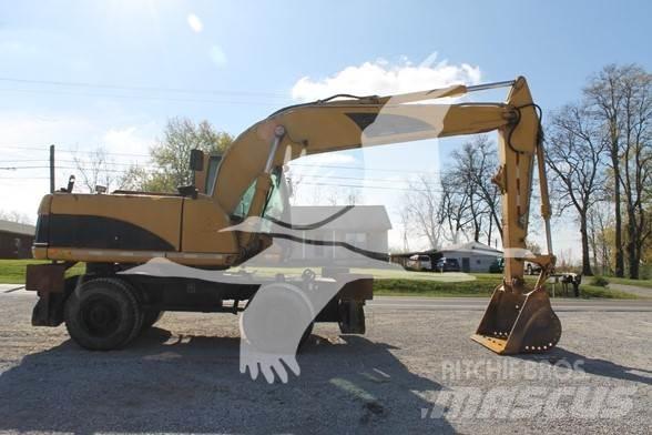 CAT M318C Ekskavatori uz riteņiem