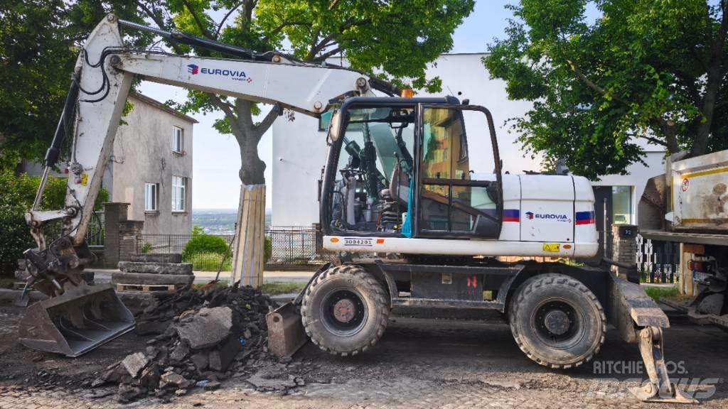 CAT 313 D Ekskavatori uz riteņiem