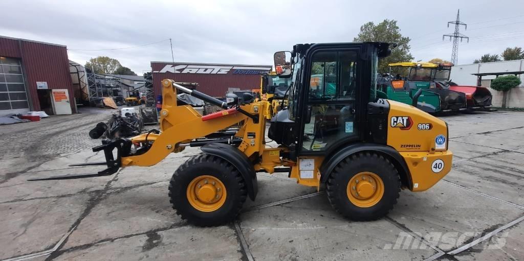 CAT 906 Iekrāvēji uz riteņiem