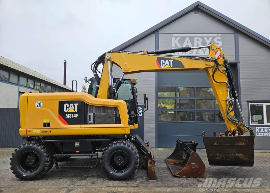 CAT M 314 Ekskavatori uz riteņiem