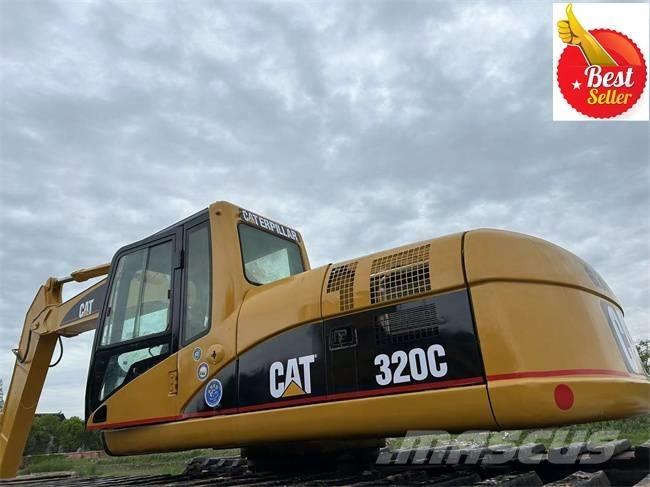 CAT 320 C Amfībijas tipa ekskavatori