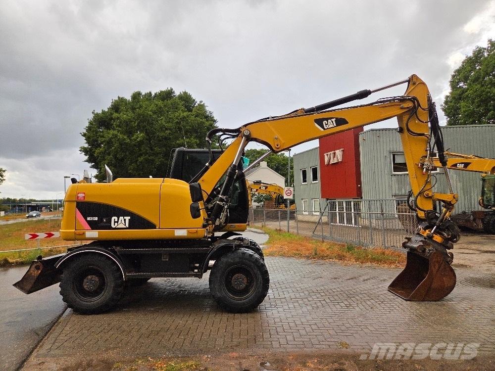 CAT M313D Ekskavatori uz riteņiem