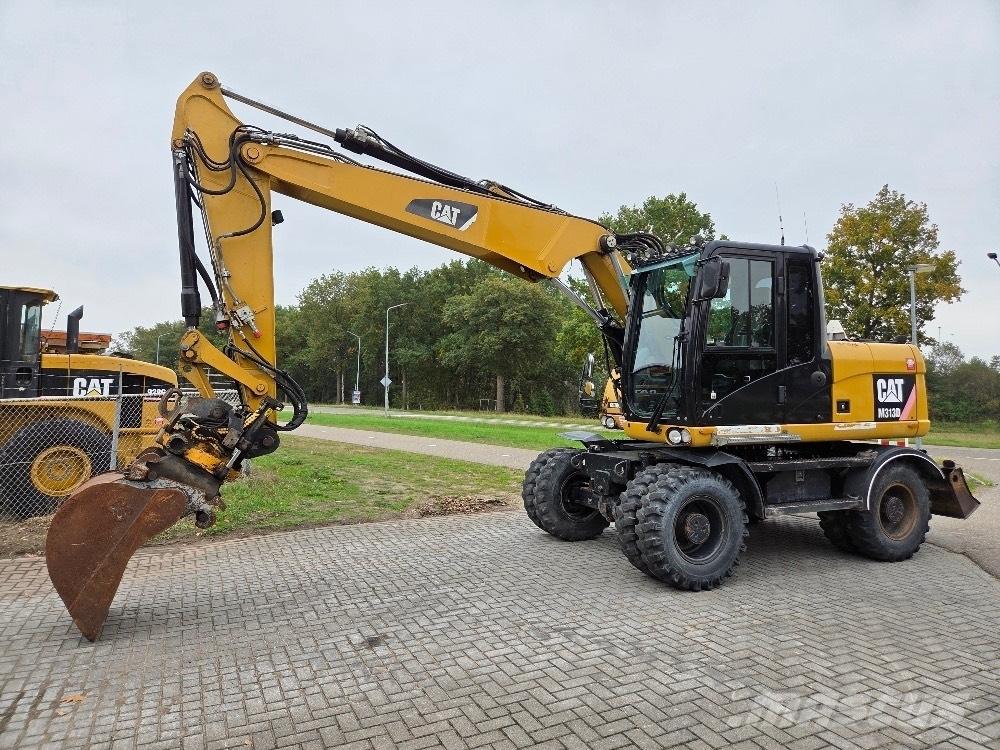 CAT M313D Ekskavatori uz riteņiem