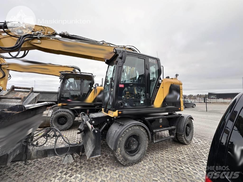 CAT M 315 Ekskavatori uz riteņiem