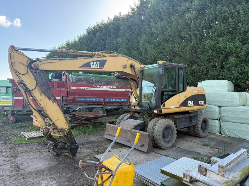CAT M 313 C Ekskavatori uz riteņiem