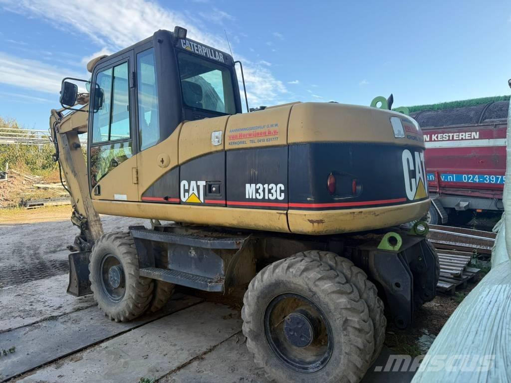 CAT M 313 C Ekskavatori uz riteņiem