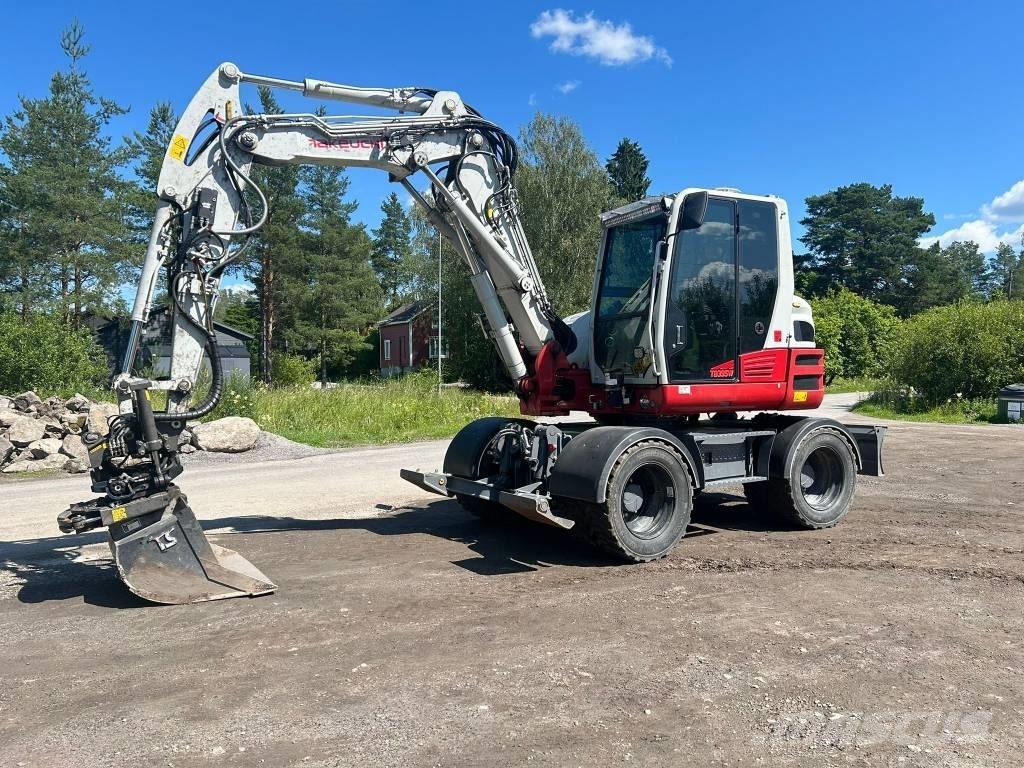 Takeuchi TB395W Ekskavatori uz riteņiem