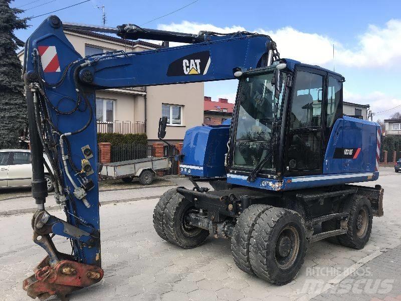 CAT M318f 318 f Ekskavatori uz riteņiem