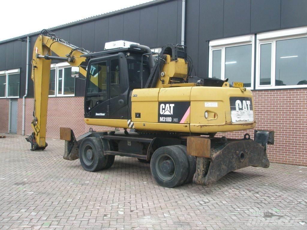 CAT M318D Ekskavatori uz riteņiem