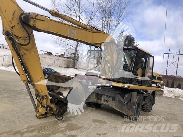 CAT M318 Ekskavatori uz riteņiem