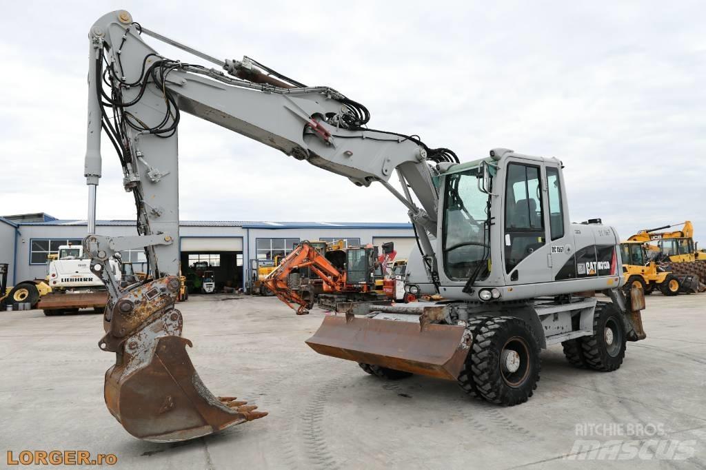 CAT M 313 D Ekskavatori uz riteņiem