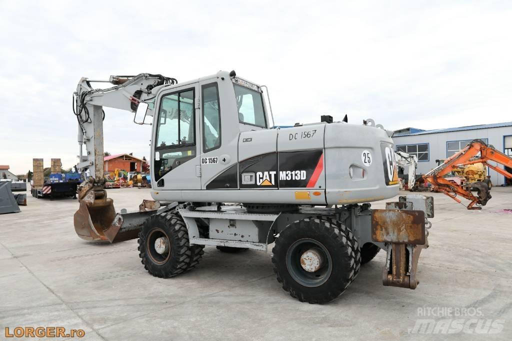 CAT M 313 D Ekskavatori uz riteņiem
